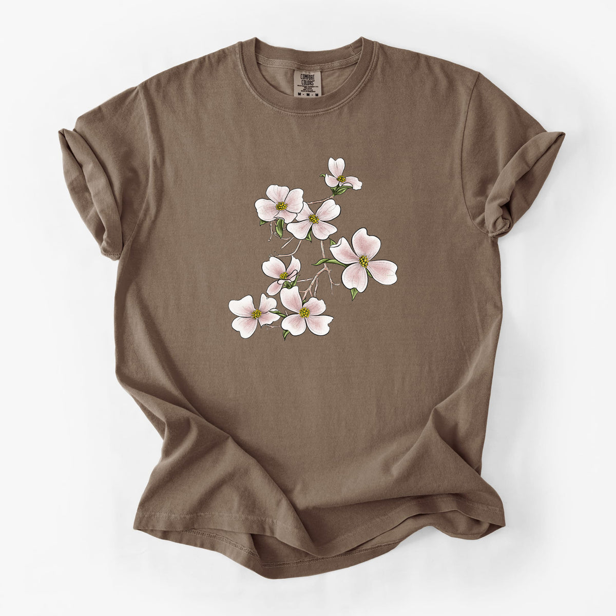 Espresso brown Comfort Colors t-shirt laid flat, printed with a full-color illustration of pink and white dogwood blossoms on a branch.