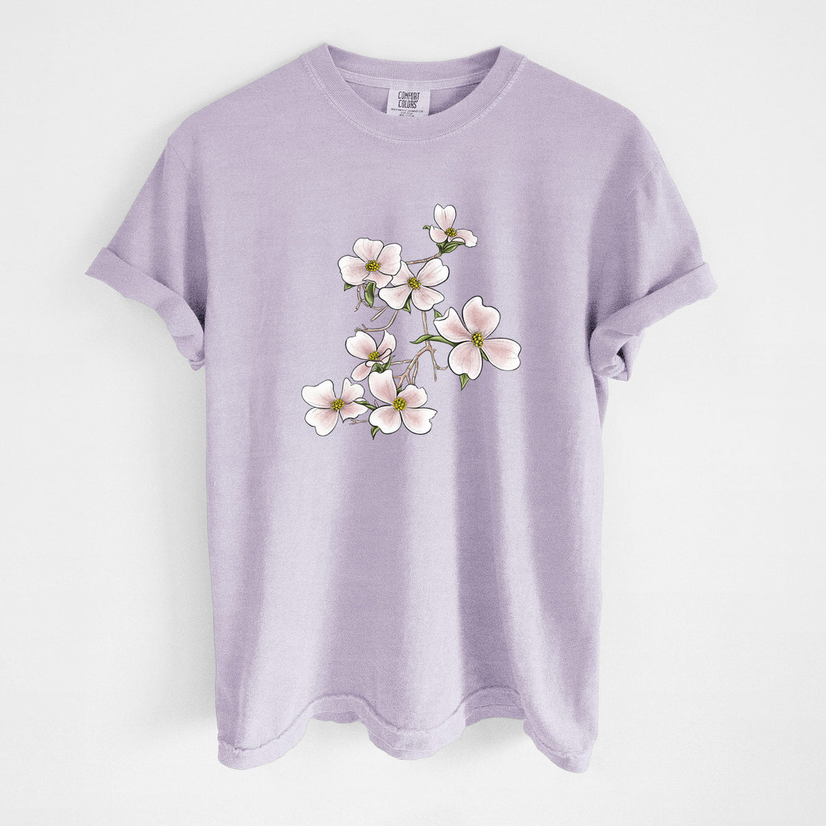 Orchid purple Comfort Colors t-shirt laid flat, printed with a full-color illustration of pink and white dogwood blossoms on a branch.