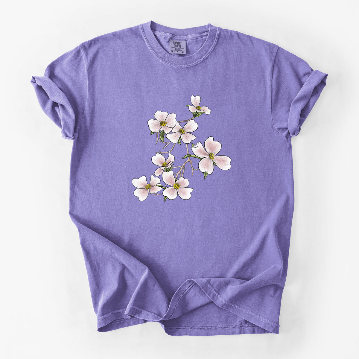 Violet purple Comfort Colors t-shirt laid flat, printed with a full-color illustration of pink and white dogwood blossoms on a branch.