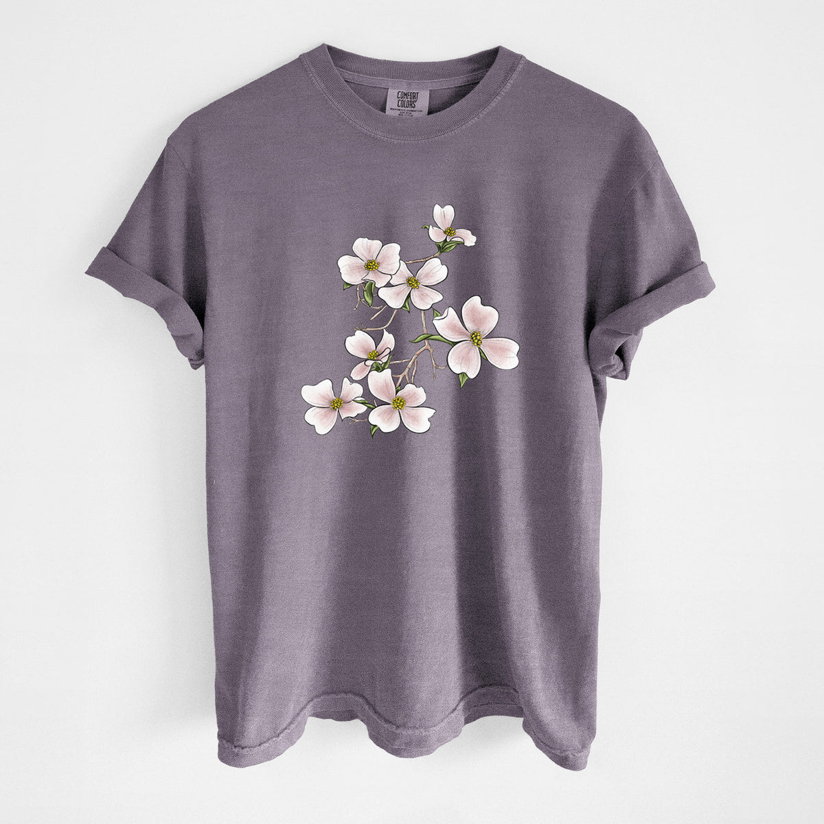 Wine red Comfort Colors t-shirt laid flat, printed with a full-color illustration of pink and white dogwood blossoms on a branch.