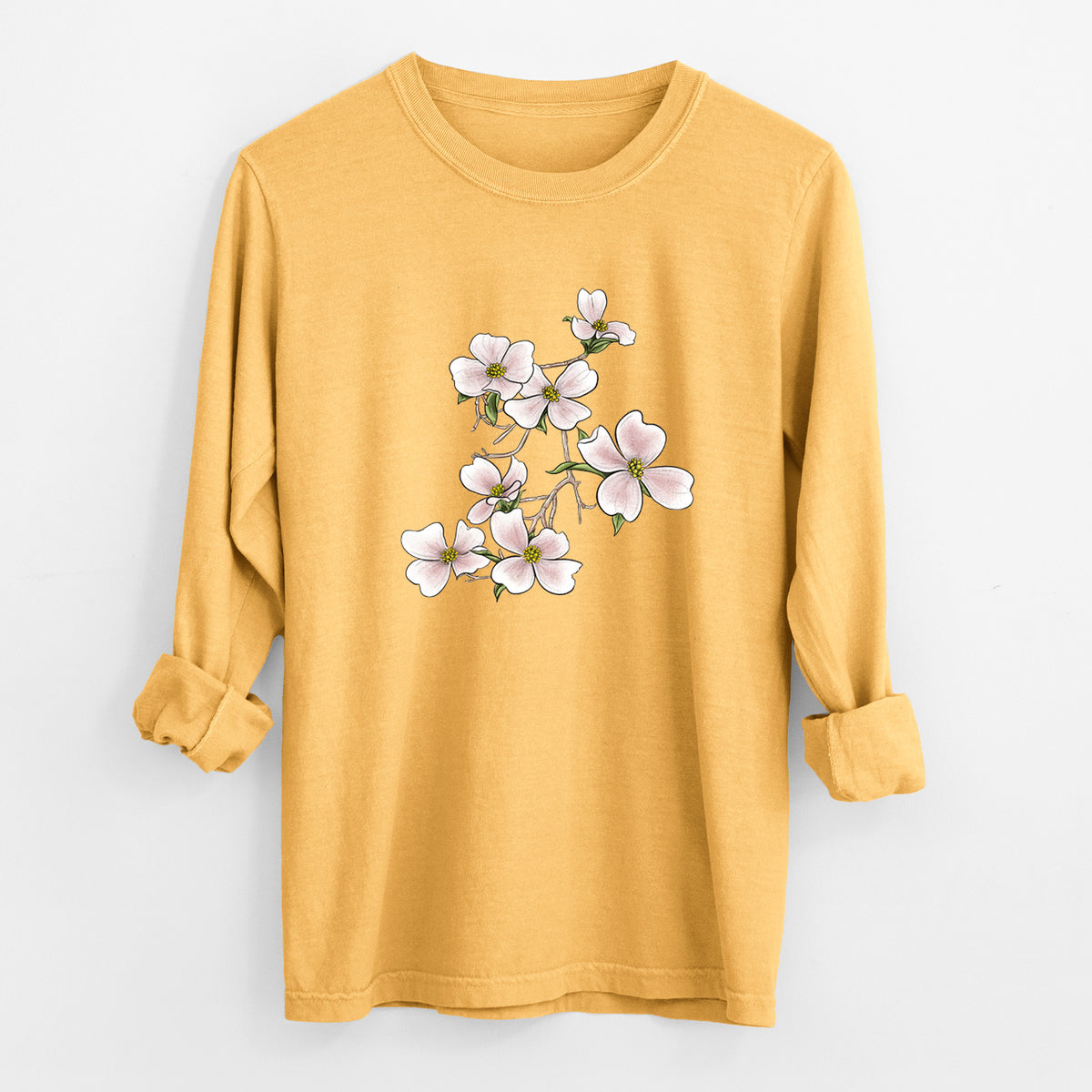 Golden wheat yellow Comfort Colors long sleeve shirt laid flat with the cuffs rolled, printed with a full-color illustration of pink and white dogwood blossoms on a branch.