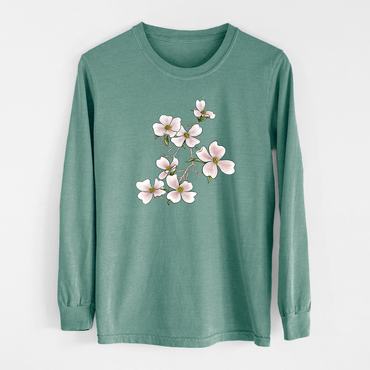 Pine green Comfort Colors long sleeve shirt laid flat, printed with a full-color illustration of pink and white dogwood blossoms on a branch.
