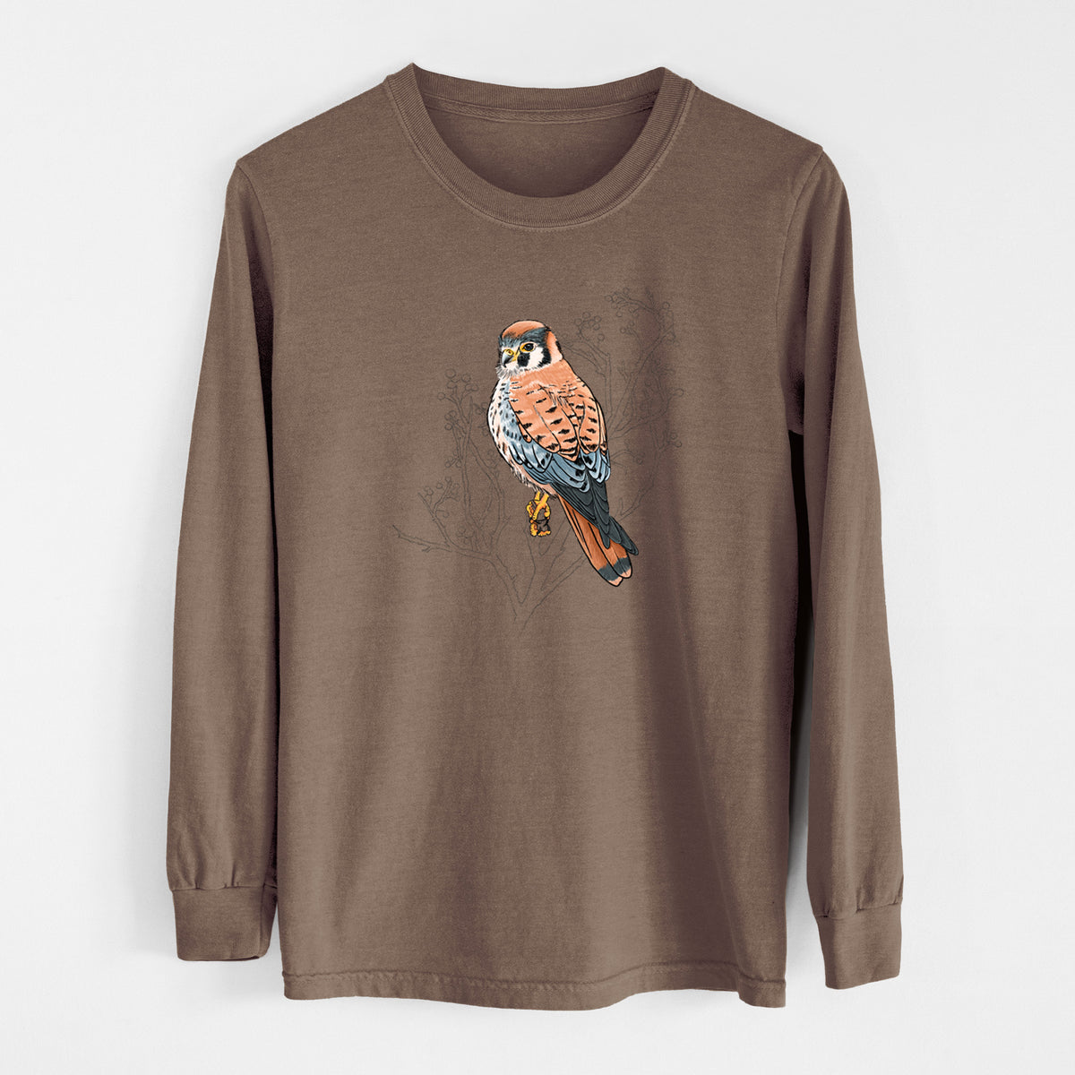 Espresso brown Comfort Colors long sleeve shirt laid flat, printed with a full-color illustration of an American kestrel perched among pale branches.