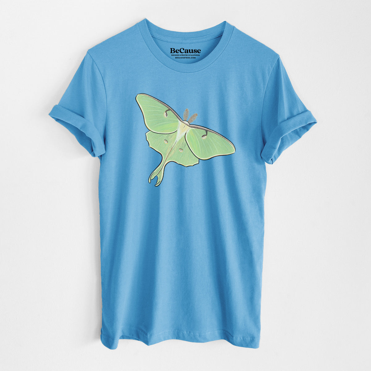 Ocean blue lightweight cotton t-shirt laid flat, printed with a full-color illustration of a pale green luna moth with long tails on its wings.