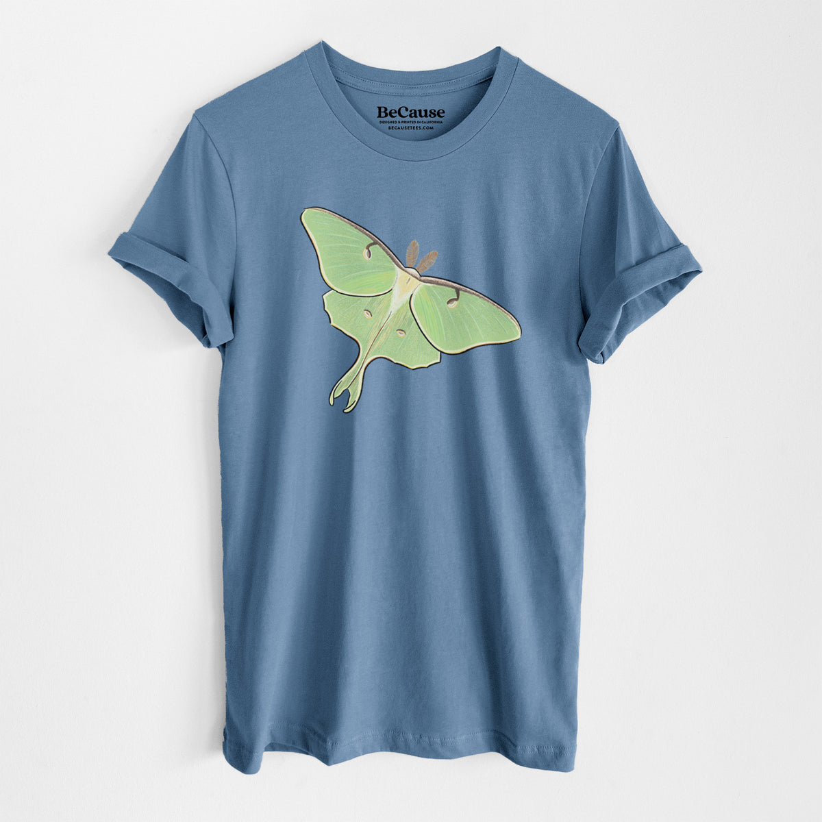 Steel blue lightweight cotton t-shirt laid flat, printed with a full-color illustration of a pale green luna moth with long tails on its wings.