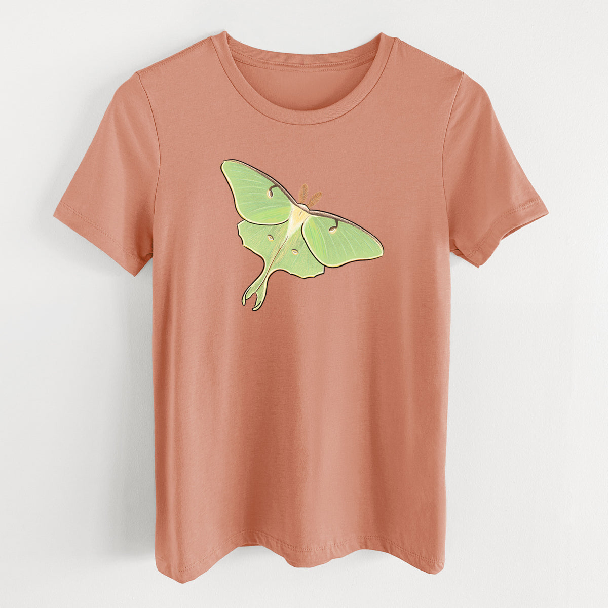 Terracotta orange women's relaxed fit cotton t-shirt laid flat, printed with a full-color illustration of a pale green luna moth with long tails on its wings.