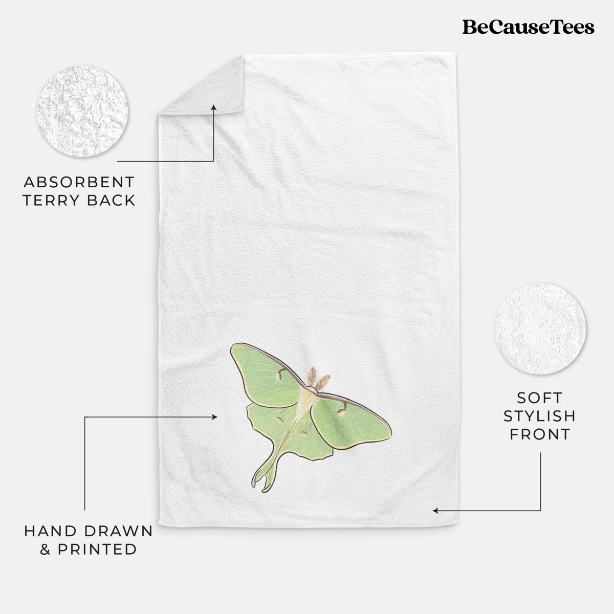 White hand towel printed with a full-color illustration of a pale green luna moth with long tails on its wings.