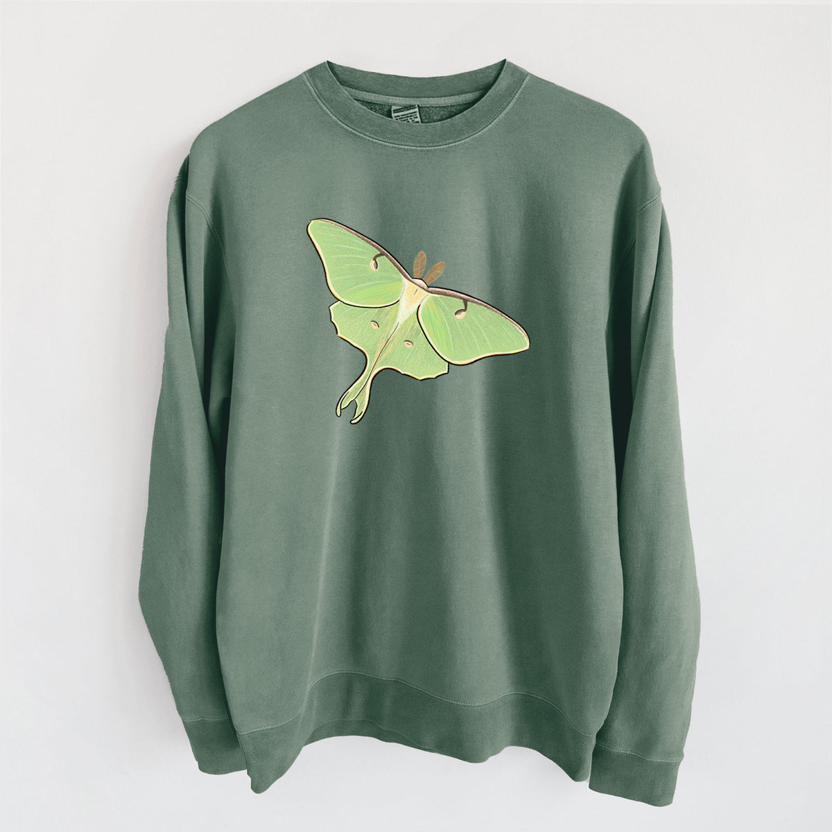 Alpine green pigment dyed crewneck sweatshirt laid flat, printed with a full-color illustration of a pale green luna moth with long tails on its wings.