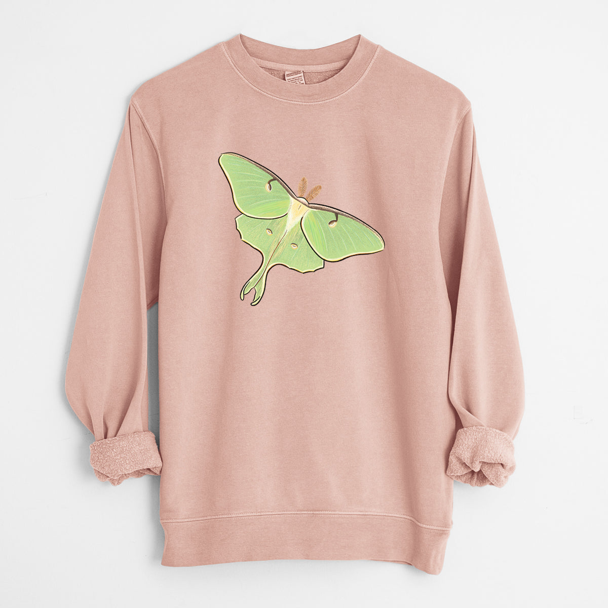 Dusty pink pigment dyed crewneck sweatshirt laid flat with the sleeves rolled, printed with a full-color illustration of a pale green luna moth with long tails on its wings.