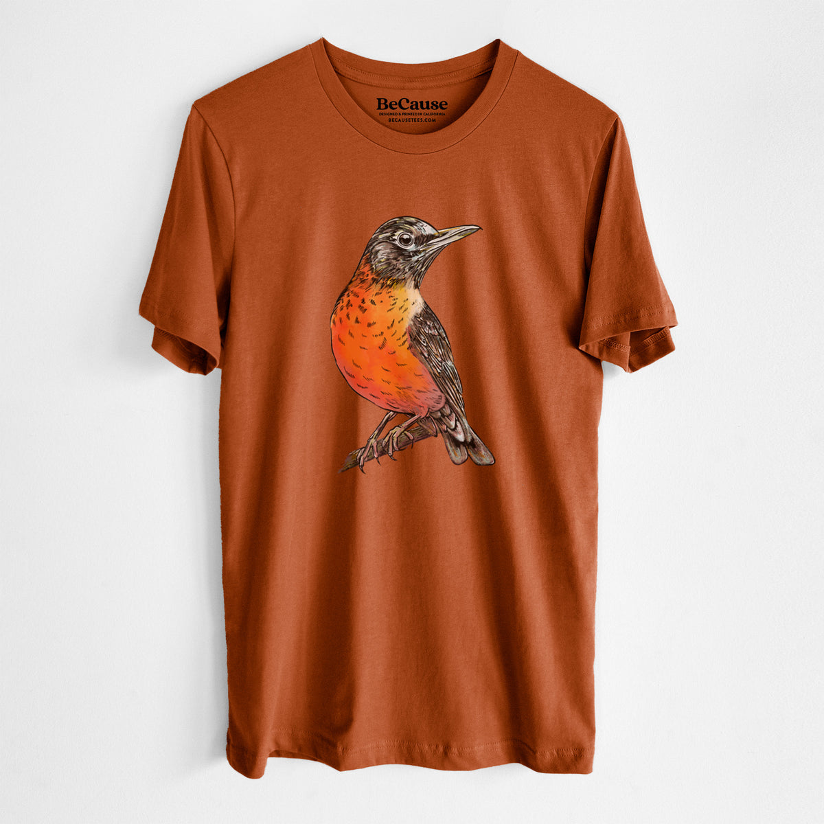 Autumn lightweight cotton t-shirt laid flat, printed with a full-color illustration of an American robin with an orange breast perched on a branch.