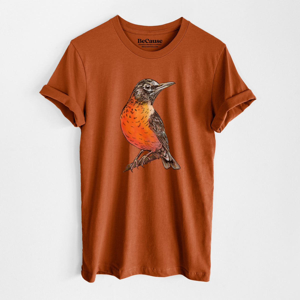 Autumn lightweight cotton t-shirt laid flat, printed with a full-color illustration of an American robin with an orange breast perched on a branch.