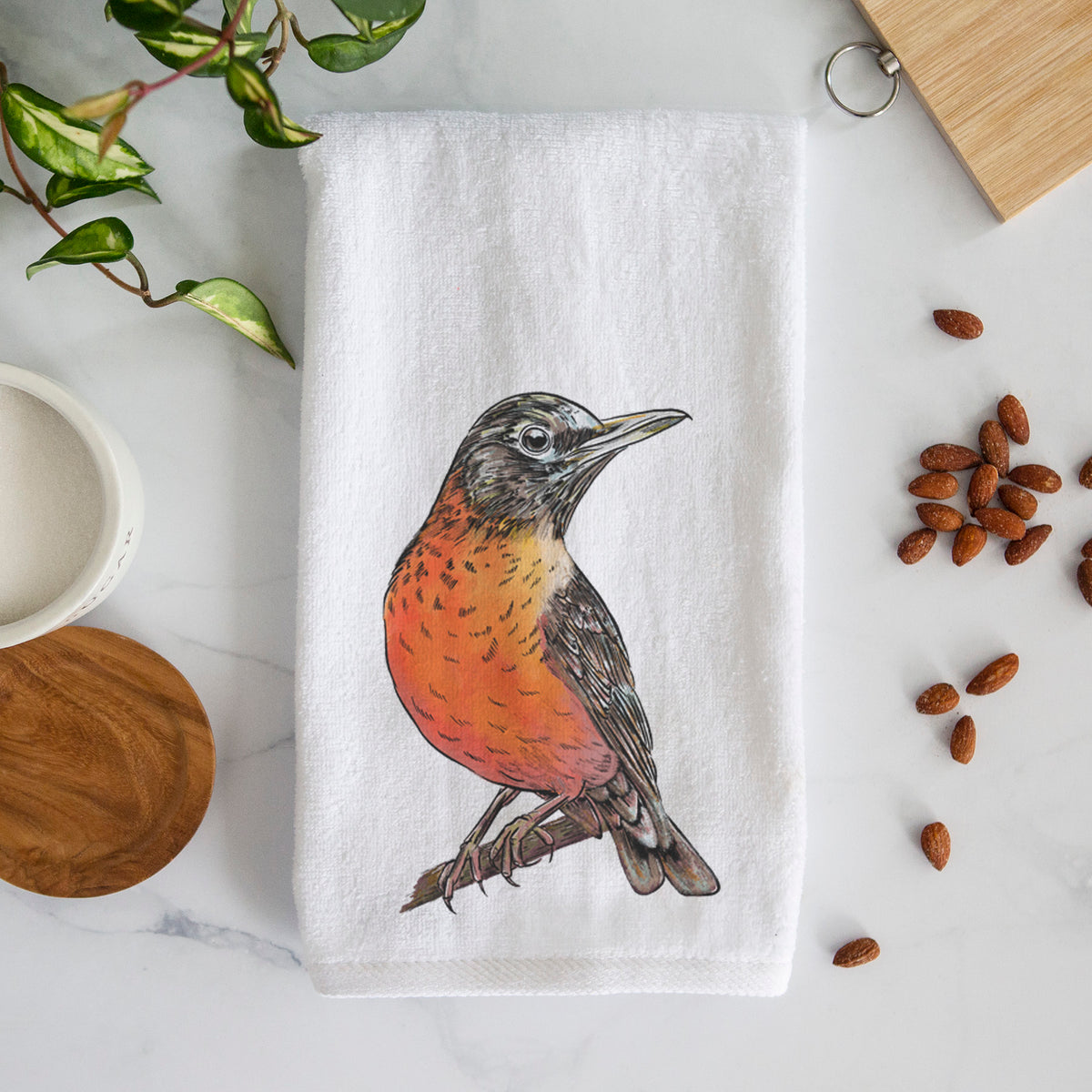 White hand towel printed with a full-color illustration of an American robin with an orange breast perched on a branch.