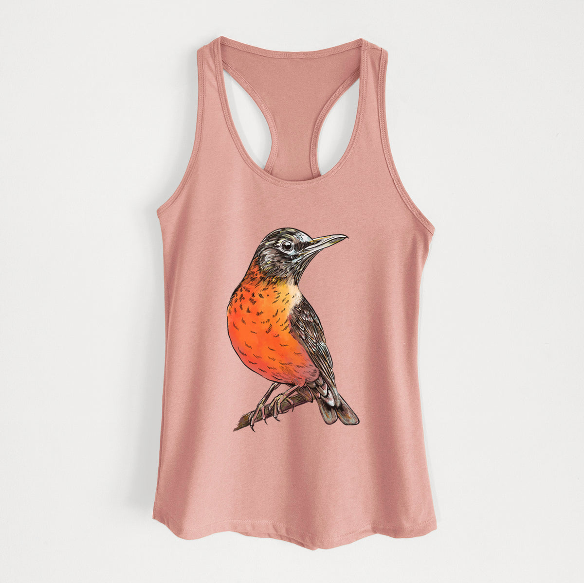 Desert pink women's racerback tank top laid flat, printed with a full-color illustration of an American robin with an orange breast perched on a branch.