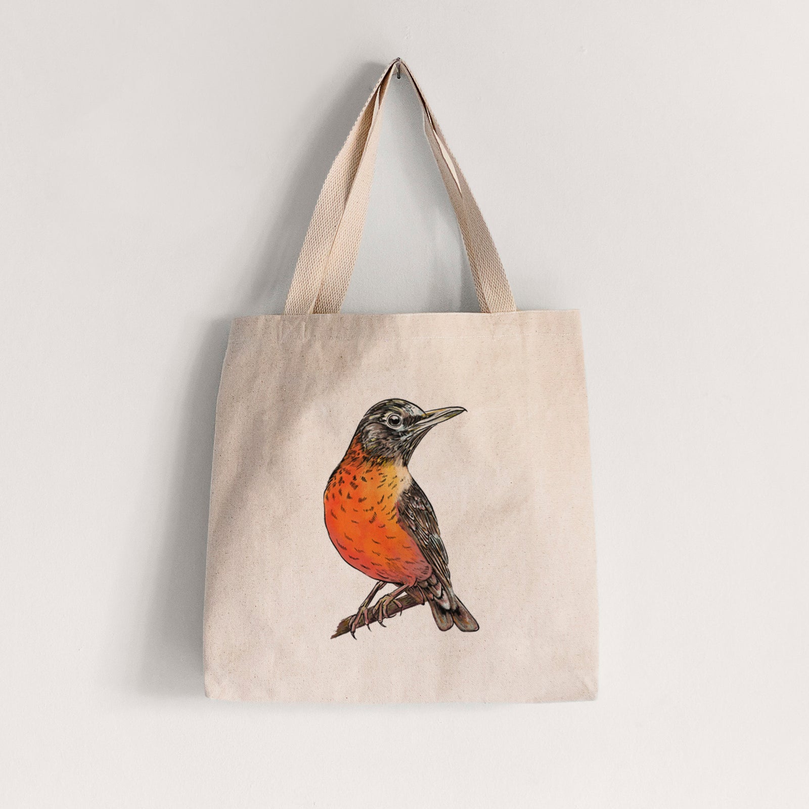 Natural canvas tote bag printed with a full-color illustration of an American robin with an orange breast perched on a branch.