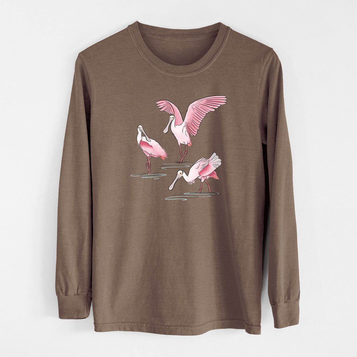 Espresso brown Comfort Colors long sleeve shirt laid flat, printed with a full-color illustration of three pink roseate spoonbills wading, one with its wings spread.