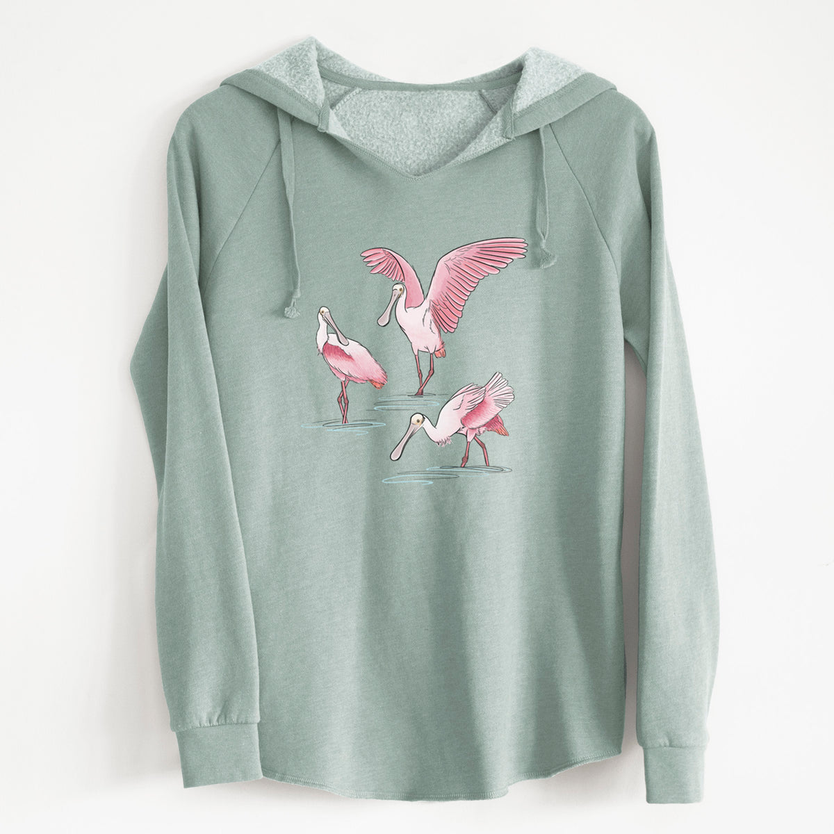 Sage green women's Cali Wave hooded sweatshirt laid flat, printed with a full-color illustration of three pink roseate spoonbills wading, one with its wings spread.