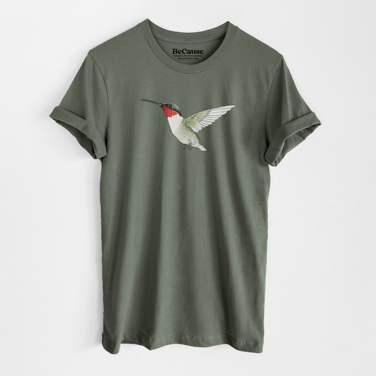 Military green lightweight cotton t-shirt laid flat, printed with a full-color illustration of a ruby-throated hummingbird in flight.