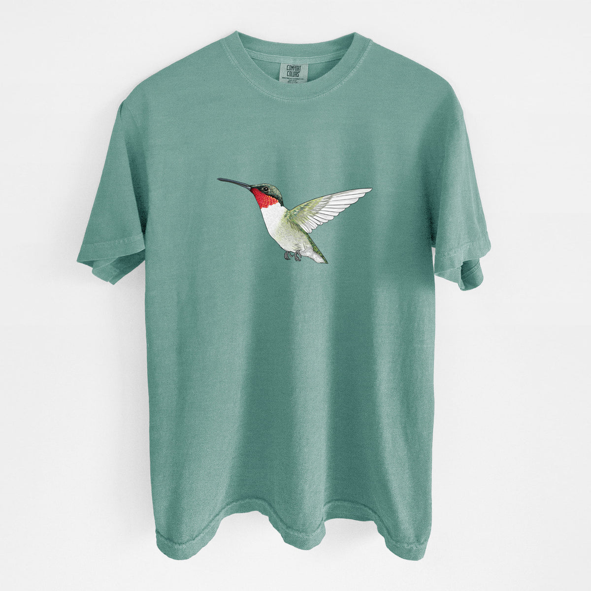 Reef green Comfort Colors t-shirt laid flat, printed with a full-color illustration of a ruby-throated hummingbird in flight.