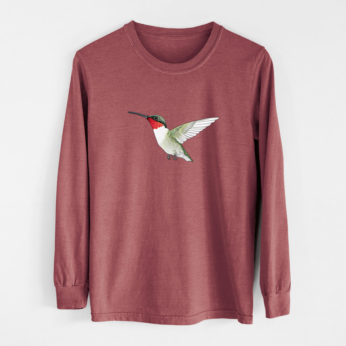 Brick red Comfort Colors long sleeve shirt laid flat, printed with a full-color illustration of a ruby-throated hummingbird in flight.