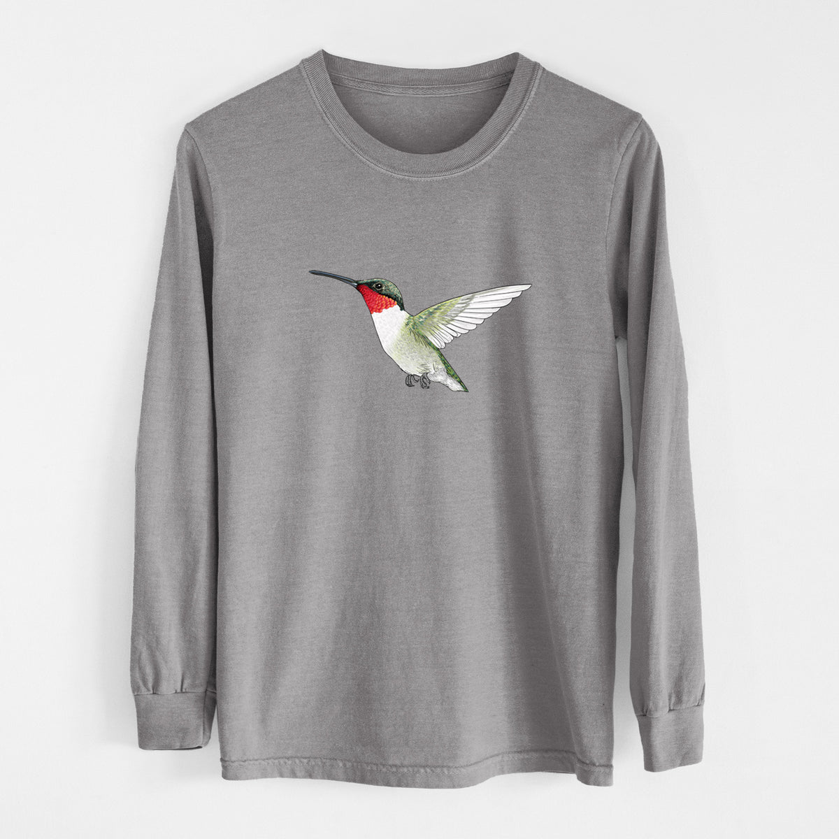 Grey Comfort Colors long sleeve shirt laid flat, printed with a full-color illustration of a ruby-throated hummingbird in flight.