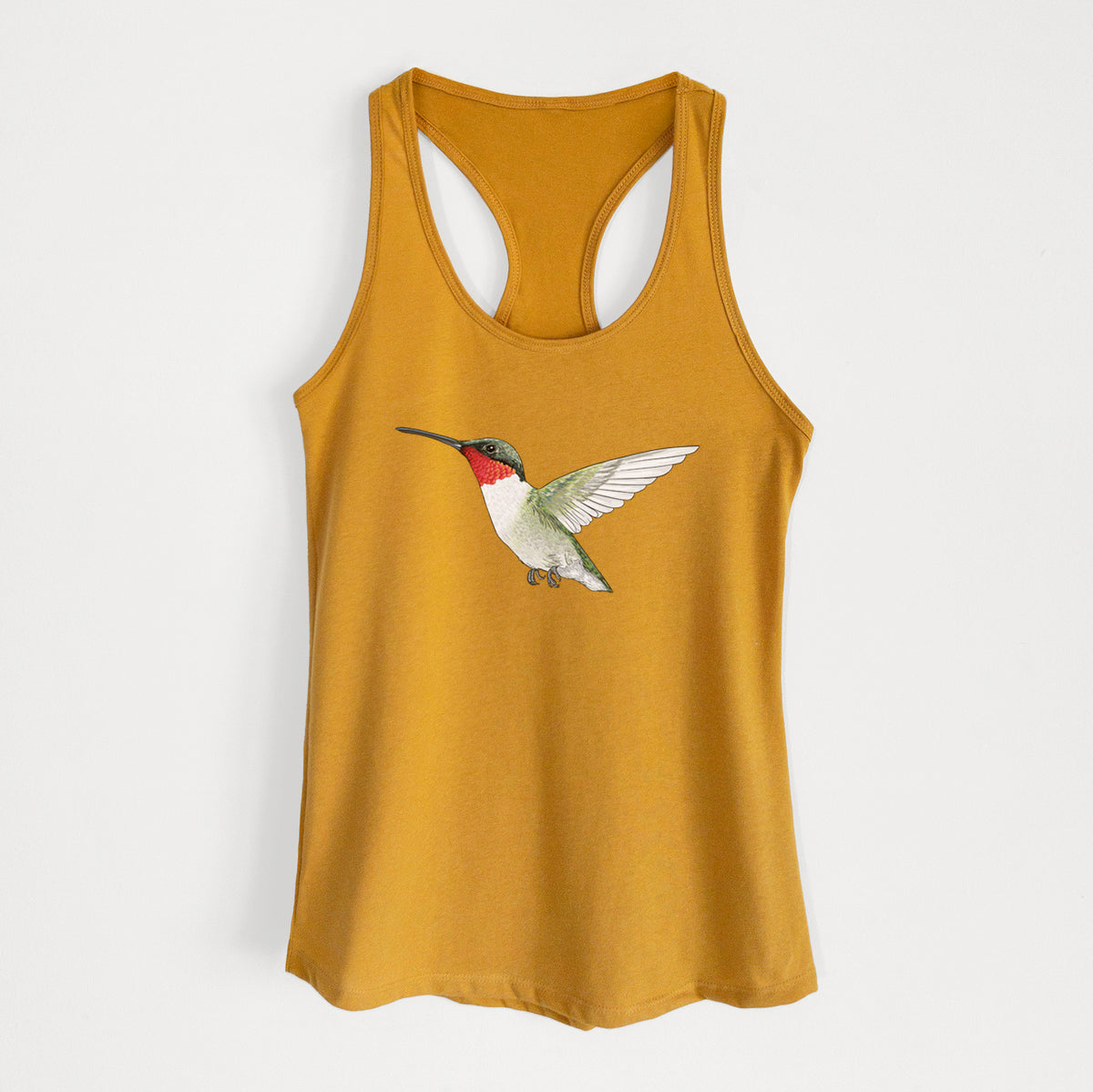 Gold women's racerback tank top laid flat, printed with a full-color illustration of a ruby-throated hummingbird in flight.