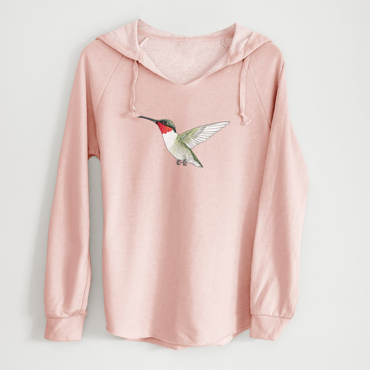 Blush pink women's Cali Wave hooded sweatshirt laid flat, printed with a full-color illustration of a ruby-throated hummingbird in flight.