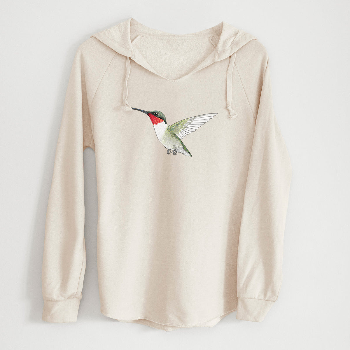 Bone cream women's Cali Wave hooded sweatshirt laid flat, printed with a full-color illustration of a ruby-throated hummingbird in flight.