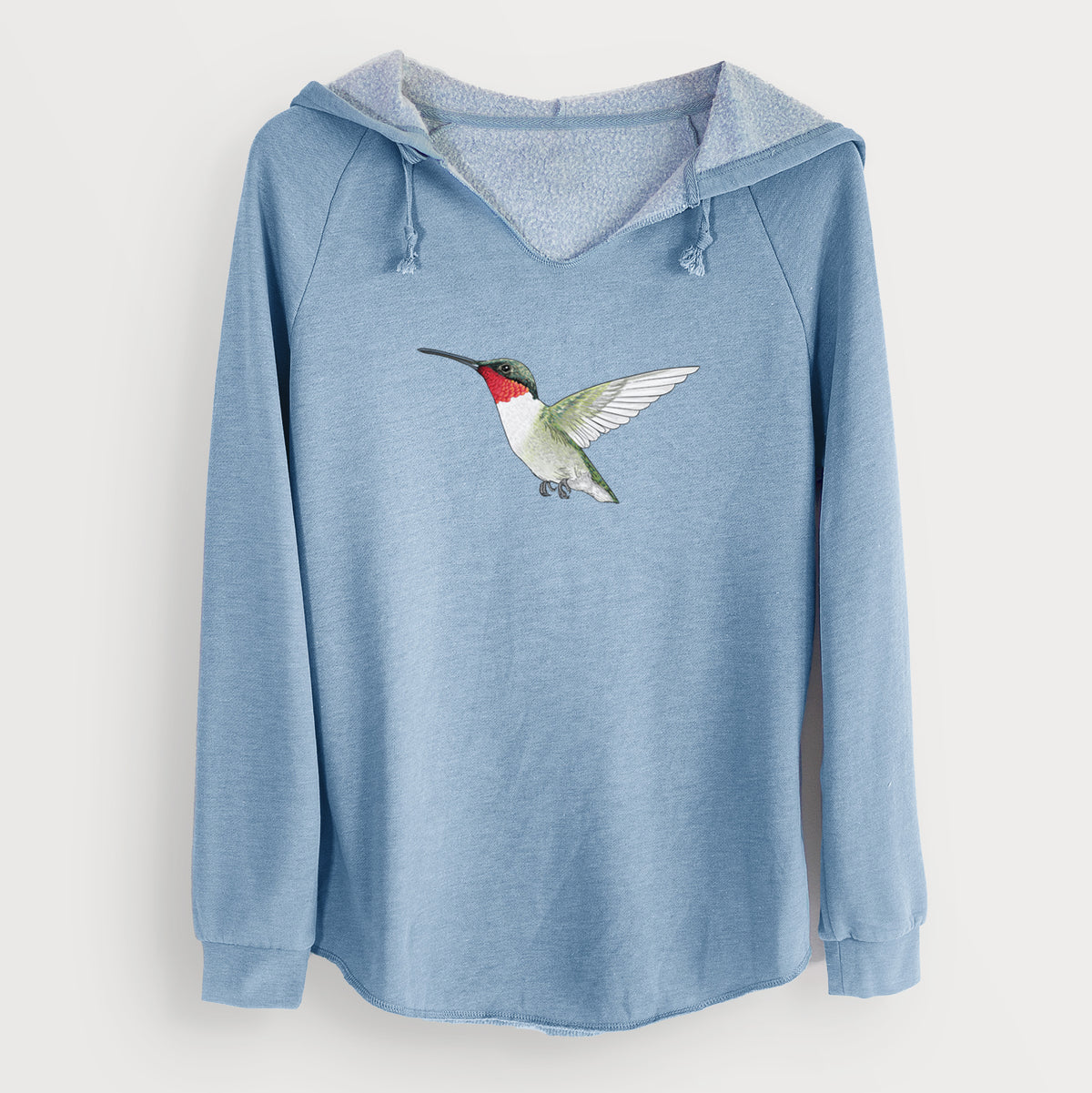 Misty blue women's Cali Wave hooded sweatshirt laid flat, printed with a full-color illustration of a ruby-throated hummingbird in flight.