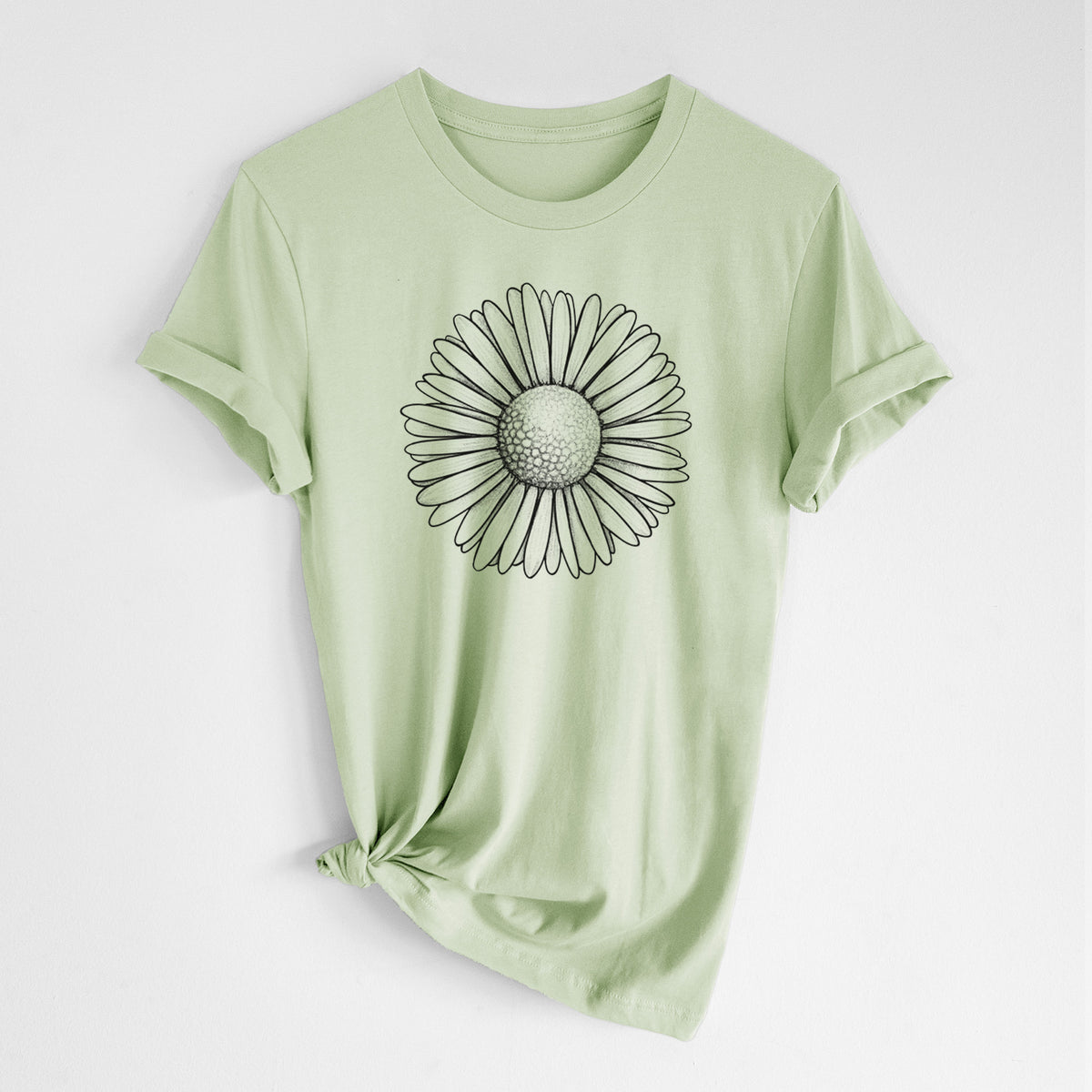 Spring green lightweight cotton t-shirt laid flat with the sleeves rolled, printed with a detailed black ink line drawing of a single common daisy flower.