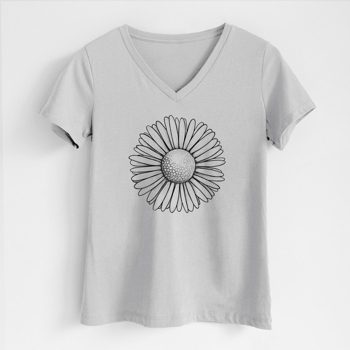 Lunar grey women's relaxed fit cotton V-neck t-shirt laid flat, printed with a detailed black ink line drawing of a single common daisy flower.