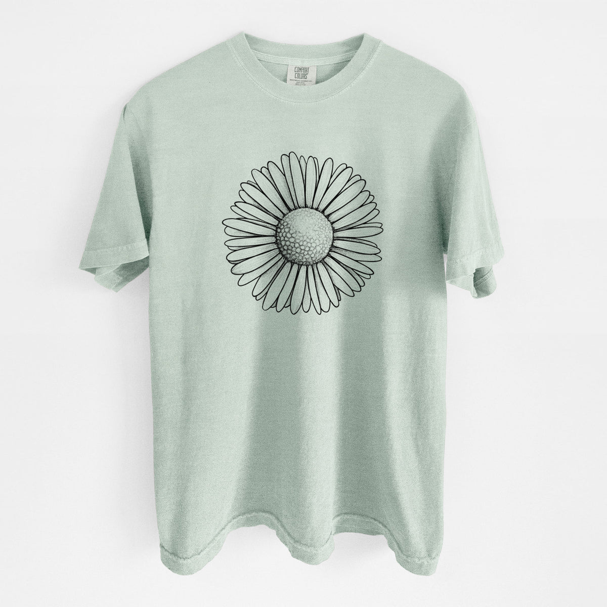 Bay green Comfort Colors t-shirt laid flat, printed with a detailed black ink line drawing of a single common daisy flower.