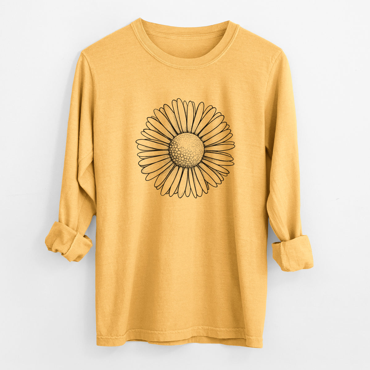 Golden wheat yellow Comfort Colors long sleeve shirt laid flat with the cuffs rolled, printed with a detailed black ink line drawing of a single common daisy flower.
