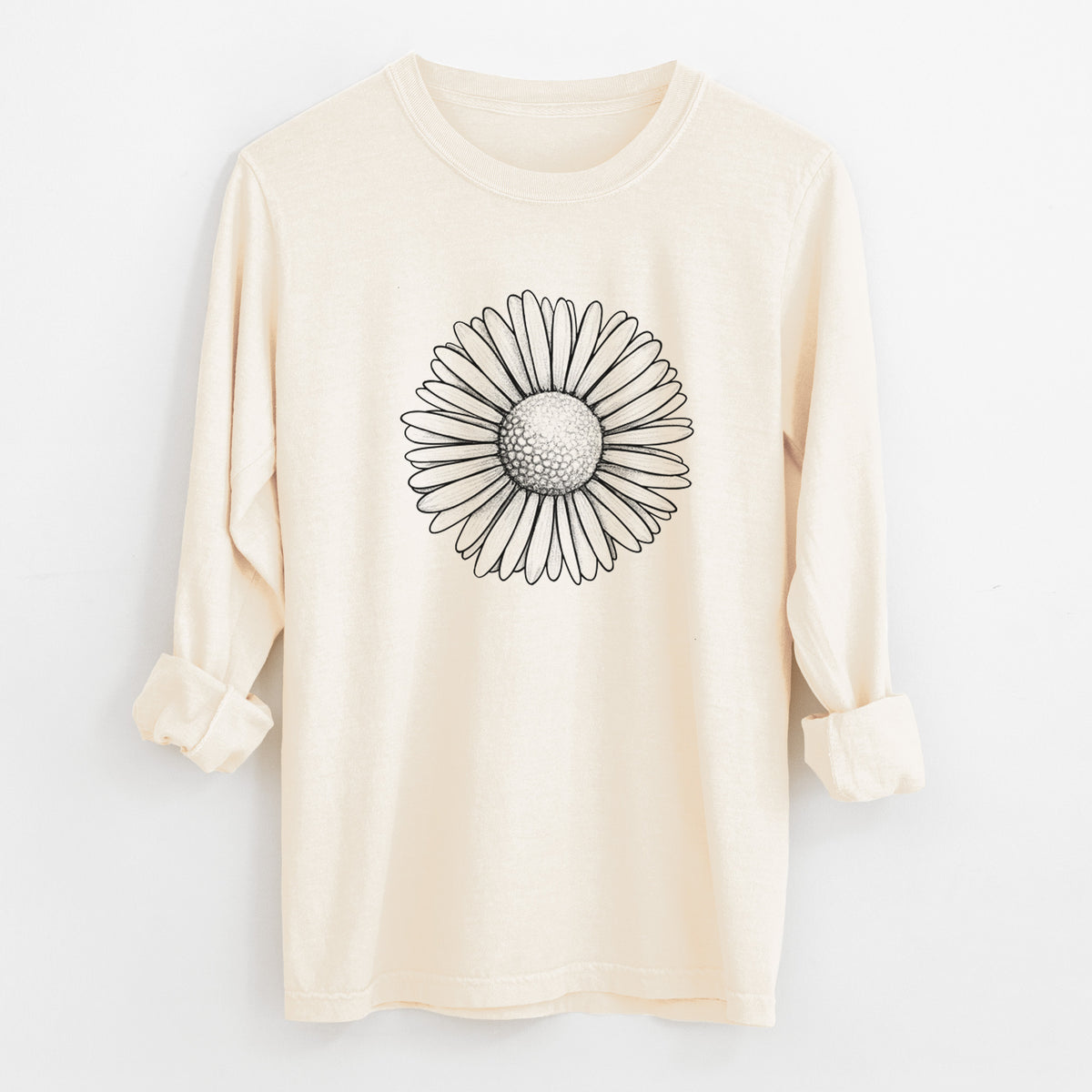 Ivory Comfort Colors long sleeve shirt laid flat with the cuffs rolled, printed with a detailed black ink line drawing of a single common daisy flower.
