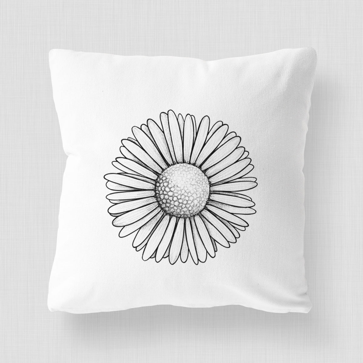 White pillow cover printed with a detailed black ink line drawing of a single common daisy flower.