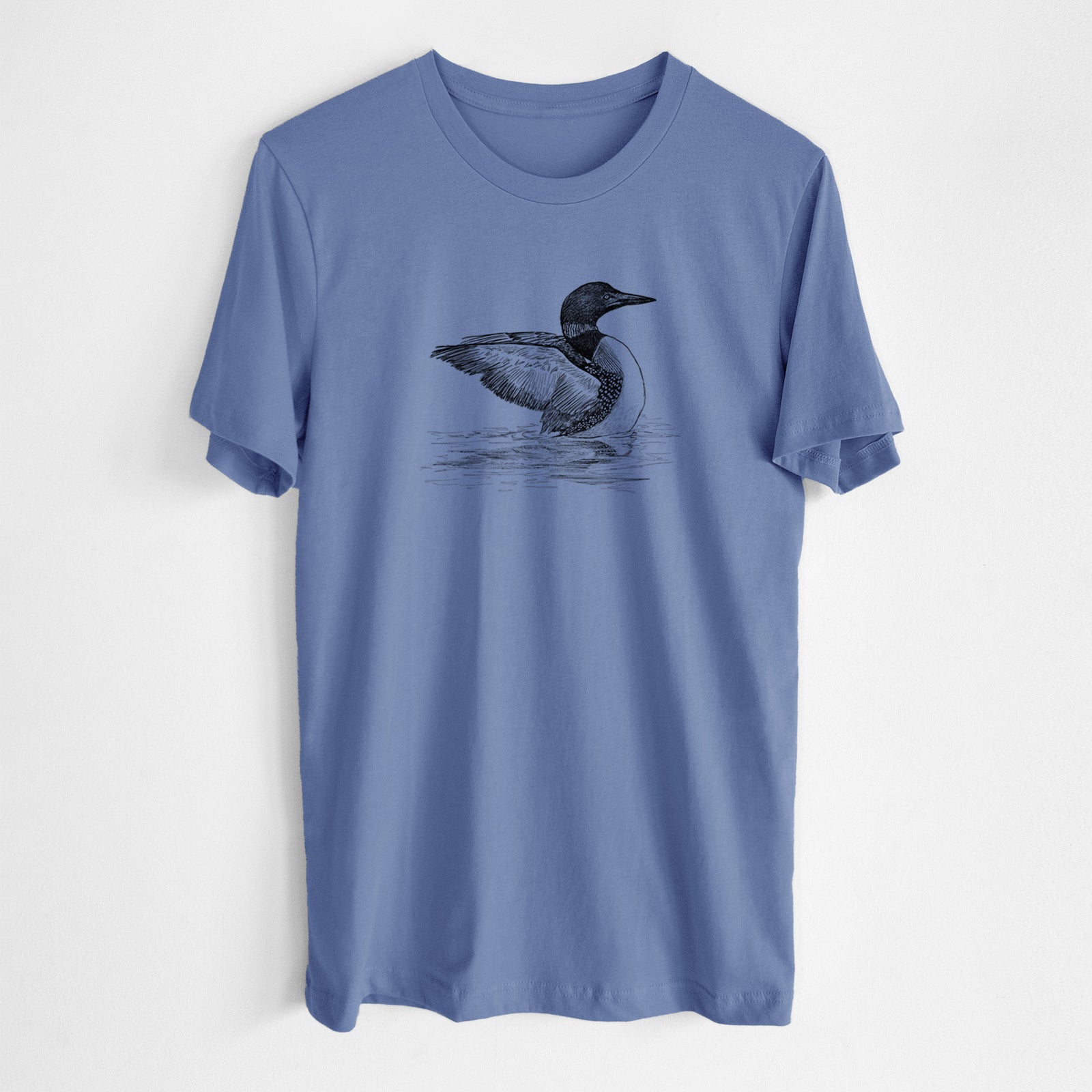 Blue bell lightweight cotton t-shirt laid flat, printed with a detailed black ink sketch of a common loon floating on rippling water.