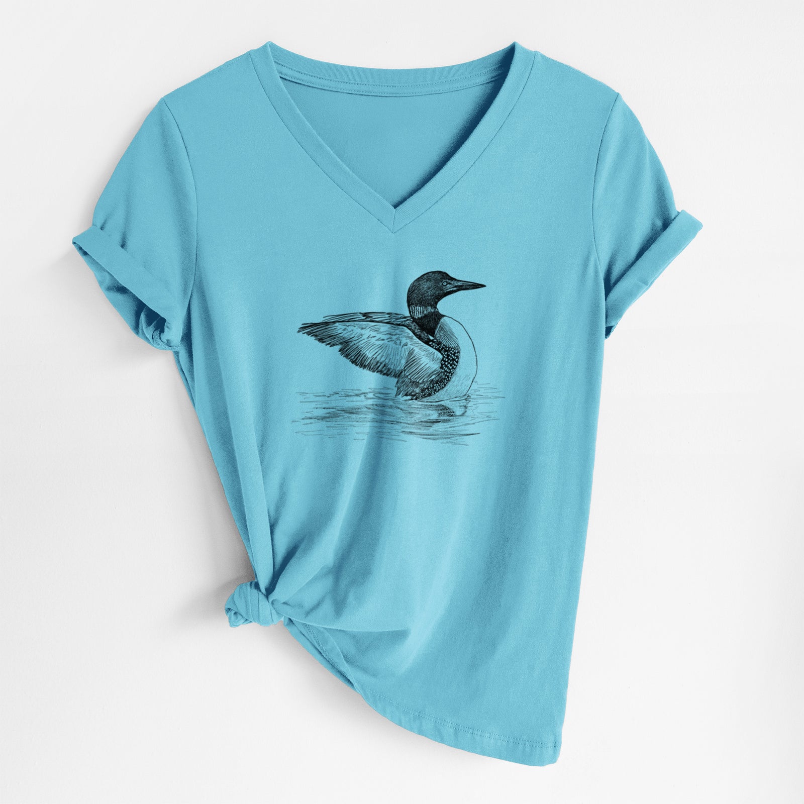 Turquoise women's relaxed fit cotton V-neck t-shirt laid flat, printed with a detailed black ink sketch of a common loon floating on rippling water.