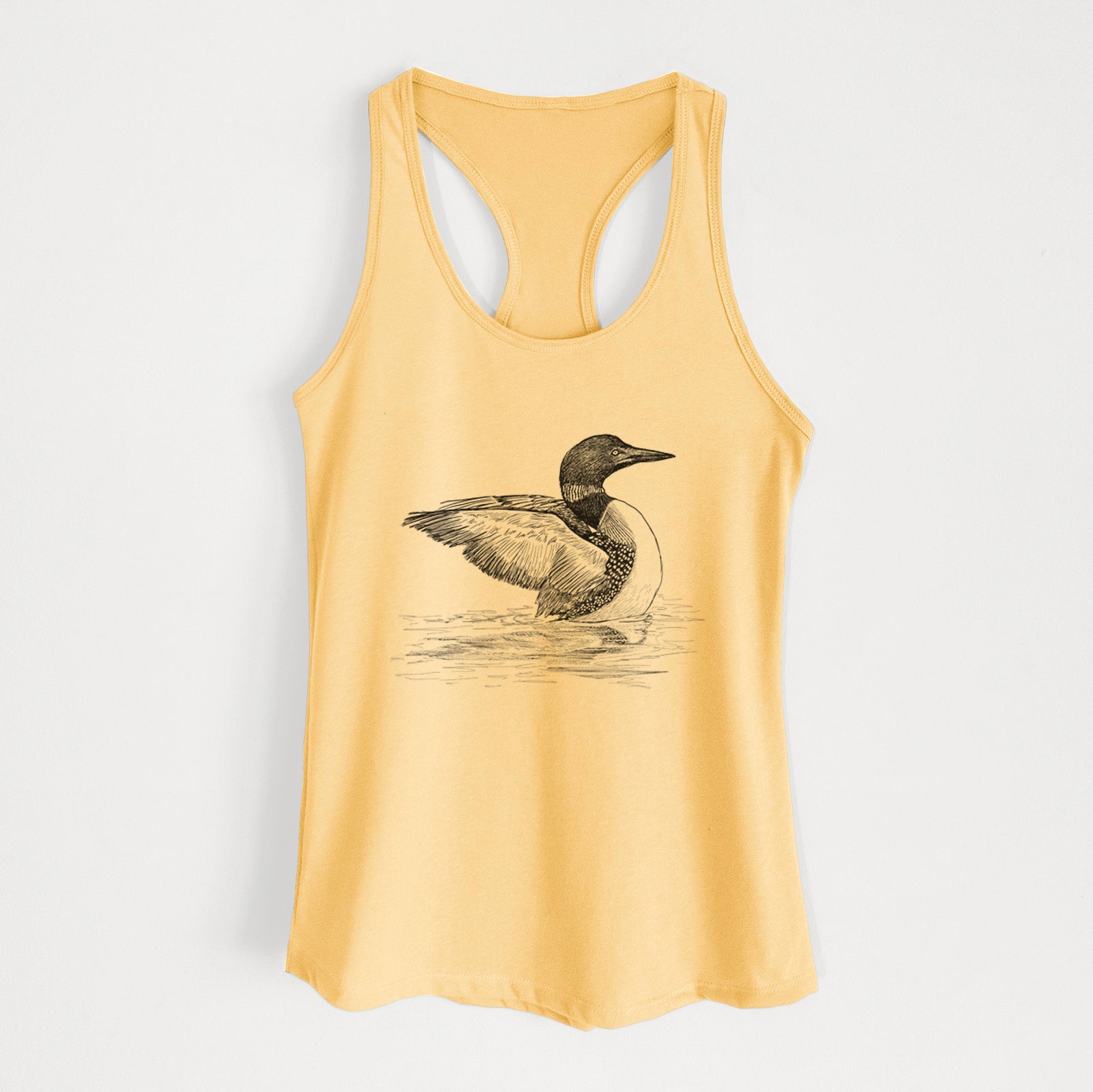 Banana cream women's racerback tank top laid flat, printed with a detailed black ink sketch of a common loon floating on rippling water.