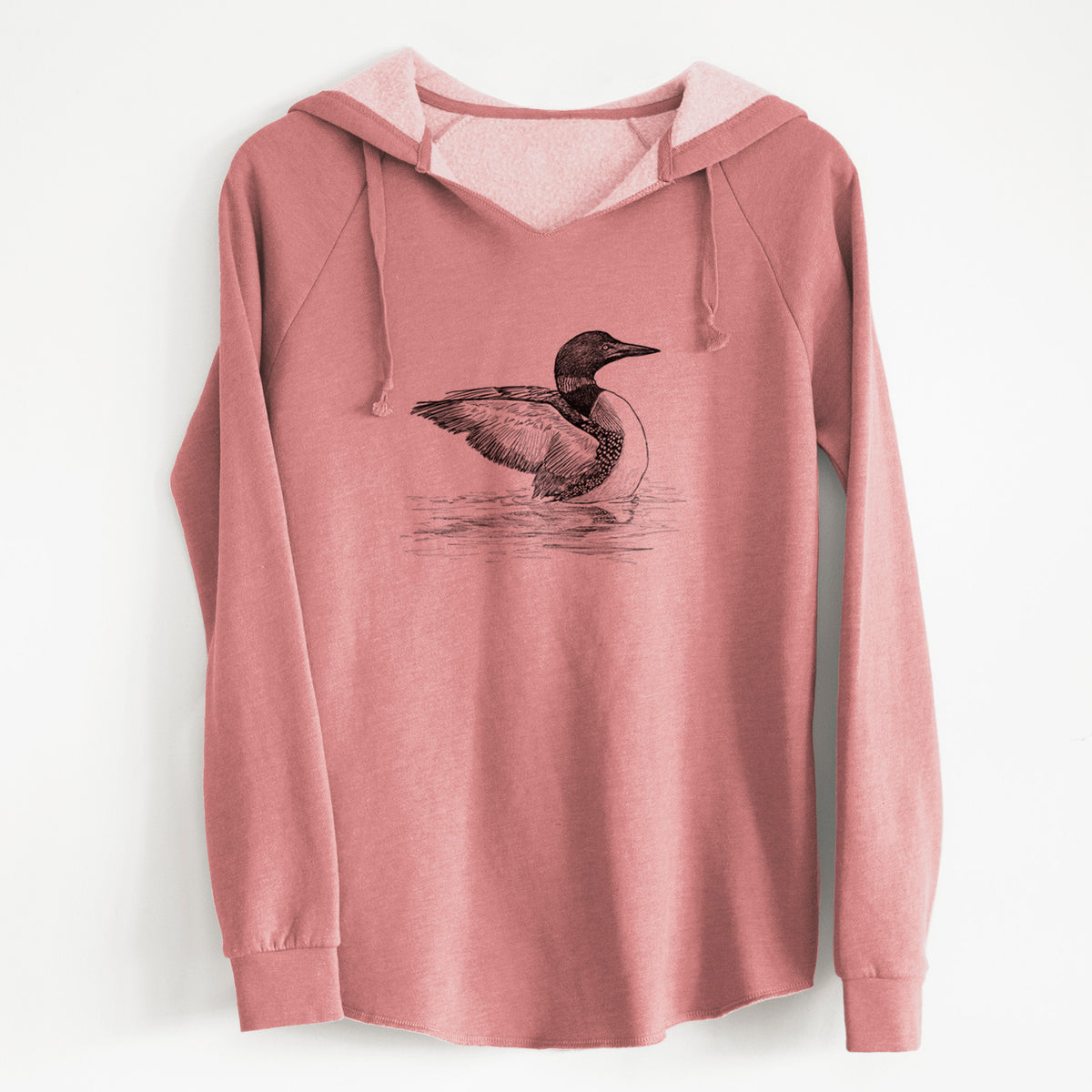 Dusty rose women's Cali Wave hooded sweatshirt laid flat, printed with a detailed black ink sketch of a common loon floating on rippling water.