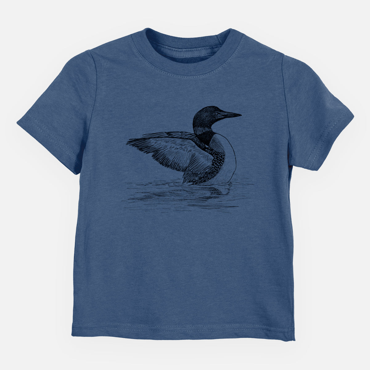 Indigo blue toddler t-shirt laid flat, printed with a detailed black ink sketch of a common loon floating on rippling water.