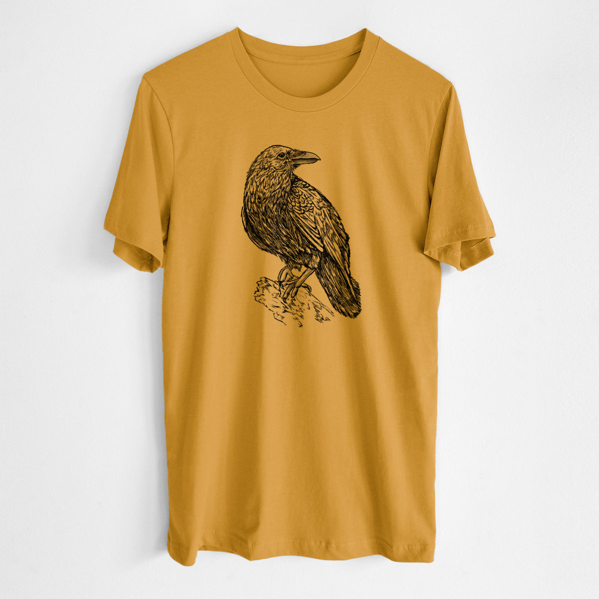 Honeycomb yellow lightweight cotton t-shirt laid flat, printed with a detailed black ink sketch of a common raven perched on a rock.