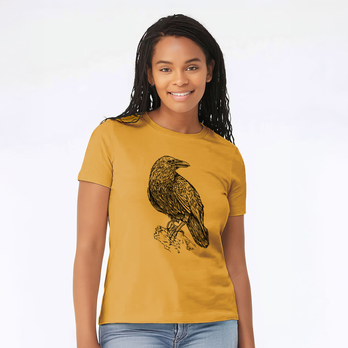 Woman wearing a mustard yellow women's relaxed fit cotton t-shirt printed with a detailed black ink sketch of a common raven perched on a rock.