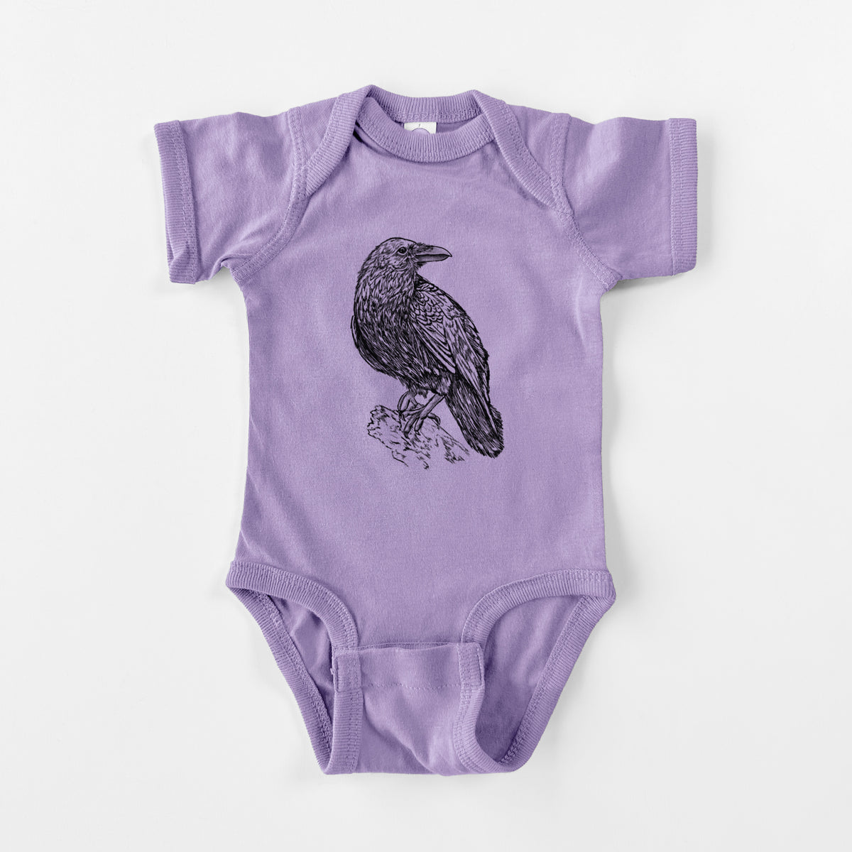 Lavender baby bodysuit laid flat, printed with a detailed black ink sketch of a common raven perched on a rock.