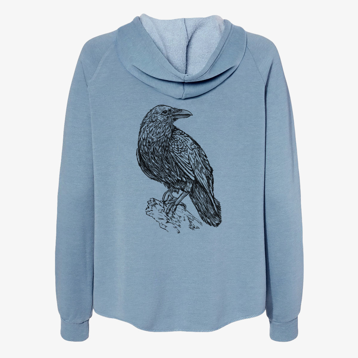 Misty blue women's Cali Wave zip-up sweatshirt laid flat, printed with a detailed black ink sketch of a common raven perched on a rock.