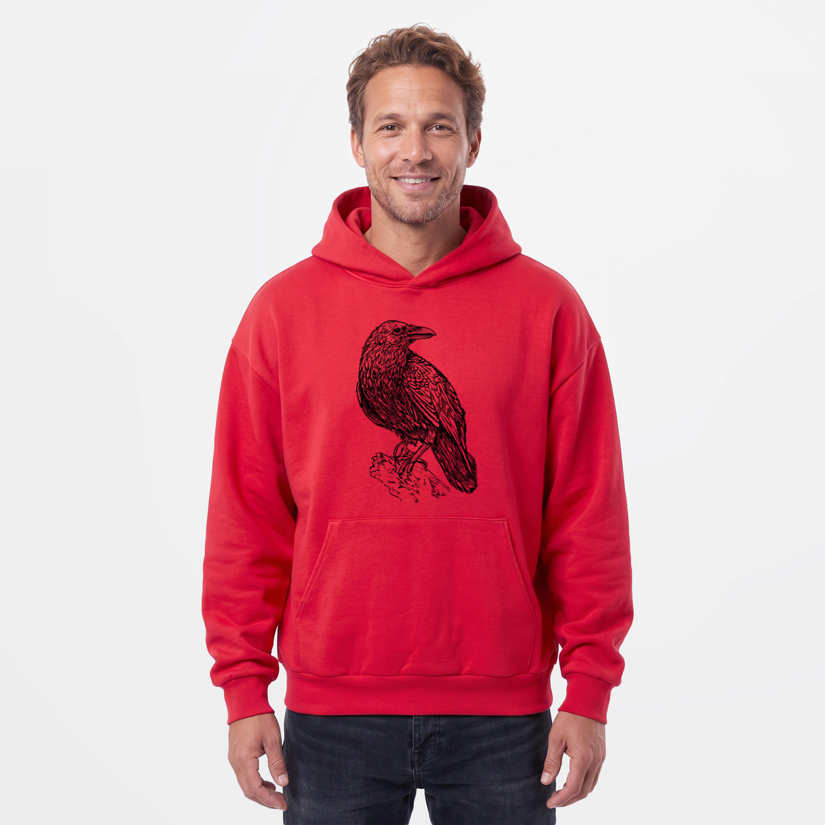 Male model wearing the Corvus corax - Common Raven - Statement Midweight Hoodie.