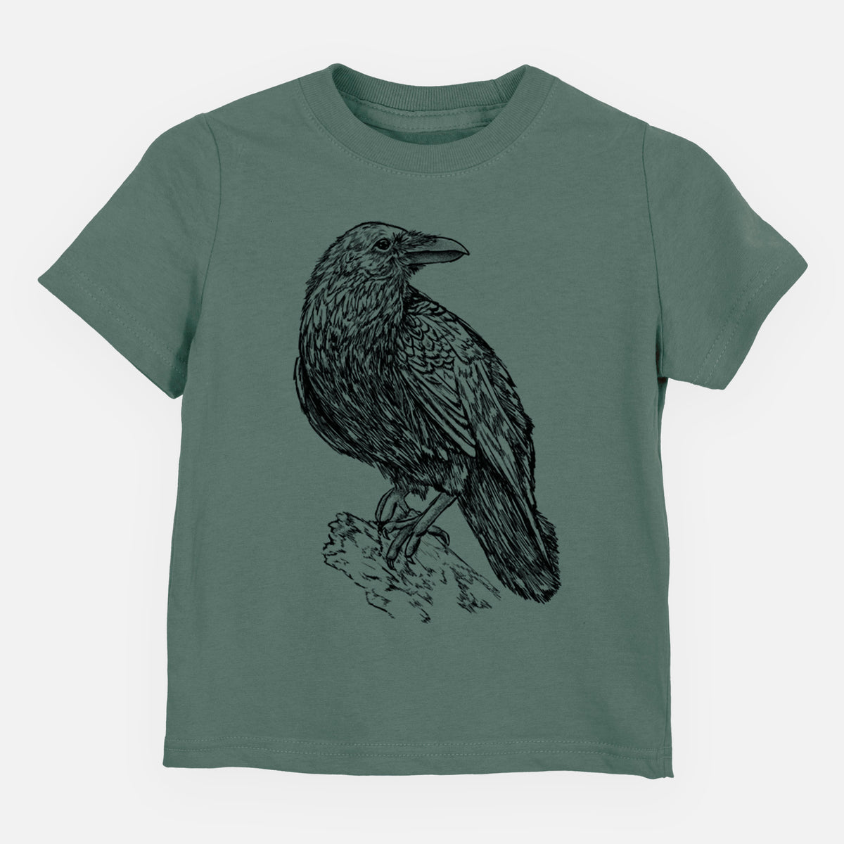 Basil green toddler t-shirt laid flat, printed with a detailed black ink sketch of a common raven perched on a rock.