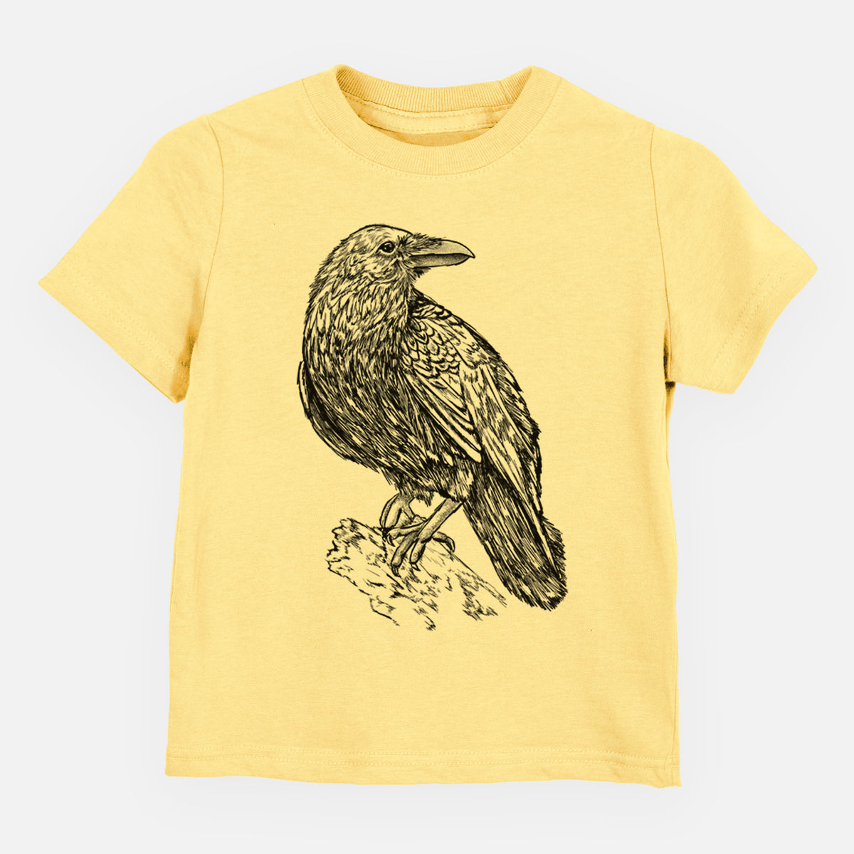 Butter yellow toddler t-shirt laid flat, printed with a detailed black ink sketch of a common raven perched on a rock.