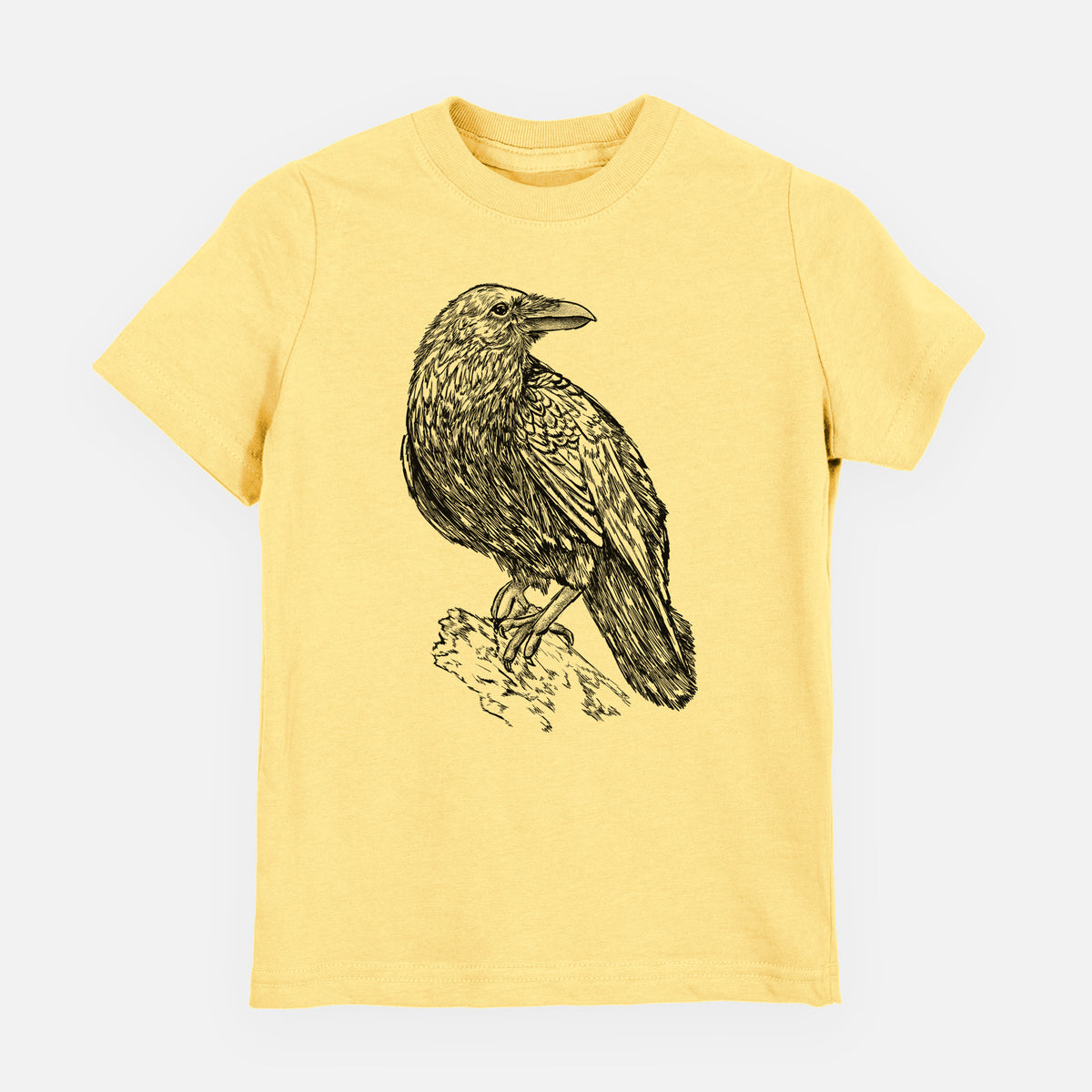 Butter yellow youth t-shirt laid flat, printed with a detailed black ink sketch of a common raven perched on a rock.