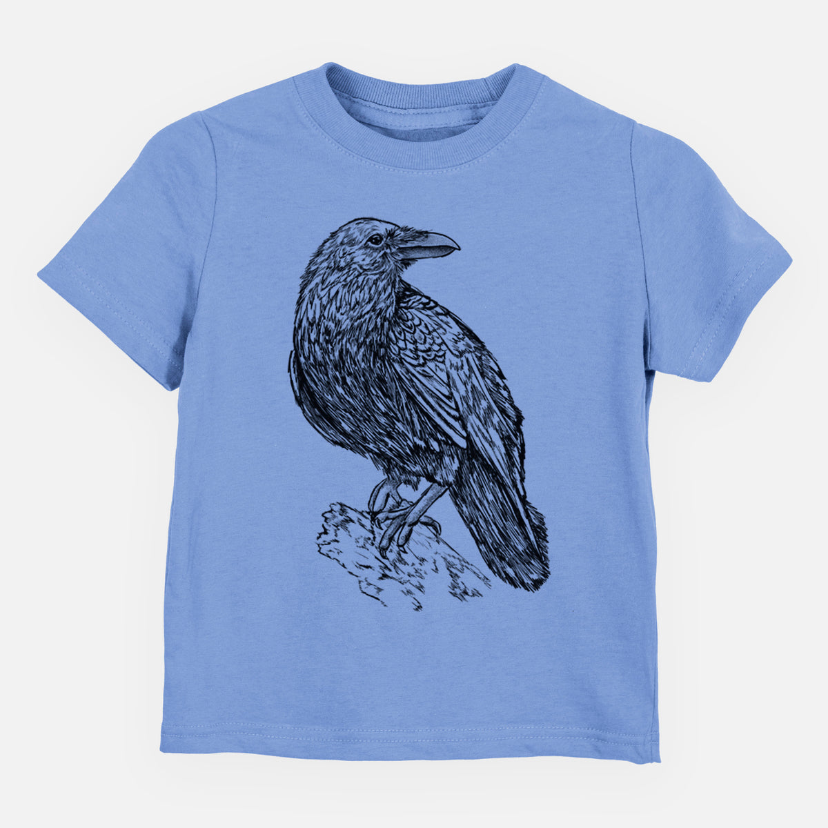 Carolina blue toddler t-shirt laid flat, printed with a detailed black ink sketch of a common raven perched on a rock.