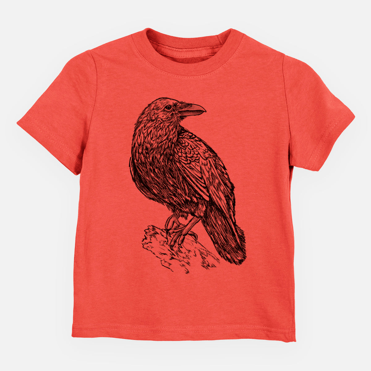 Passionfruit pink toddler t-shirt laid flat, printed with a detailed black ink sketch of a common raven perched on a rock.