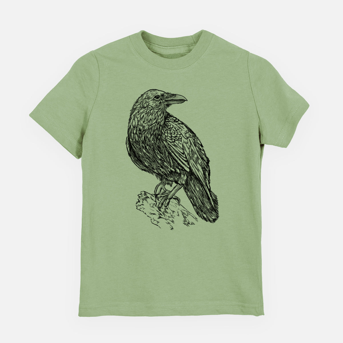 Sage green youth t-shirt laid flat, printed with a detailed black ink sketch of a common raven perched on a rock.